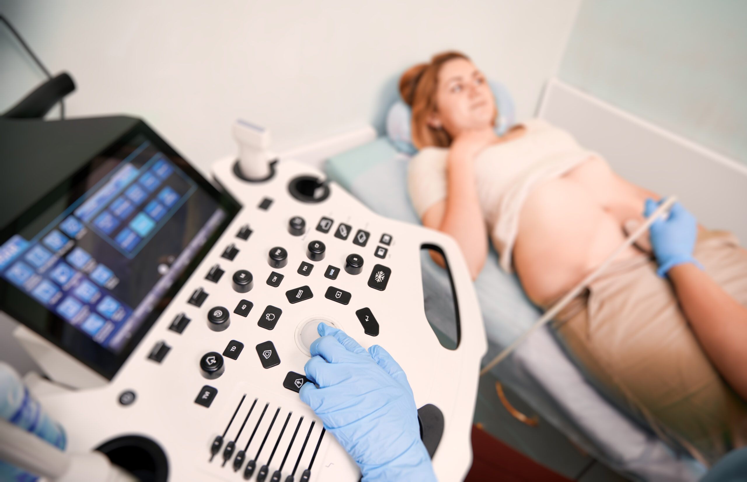 Pregnant woman undergoing a 12 week pregnancy scan