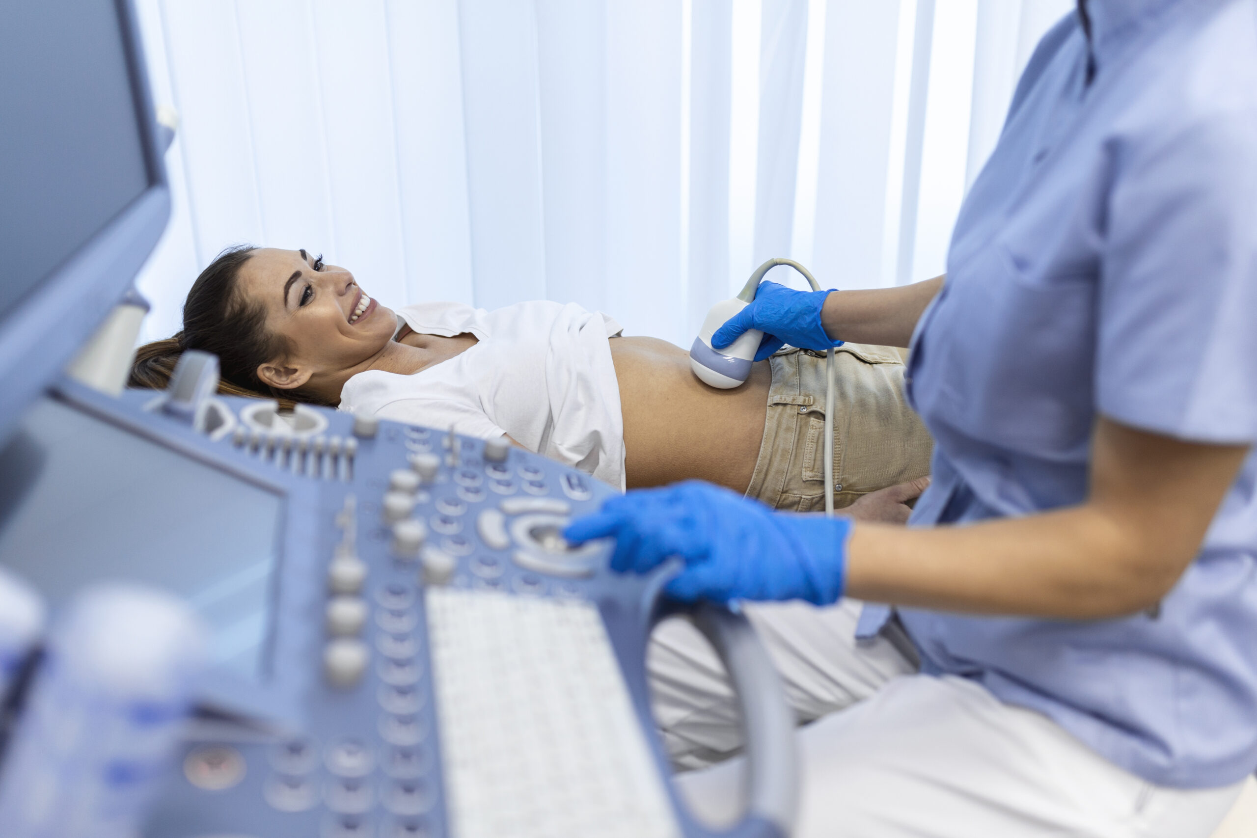Woman undergoing an ultrasound fetal scan.